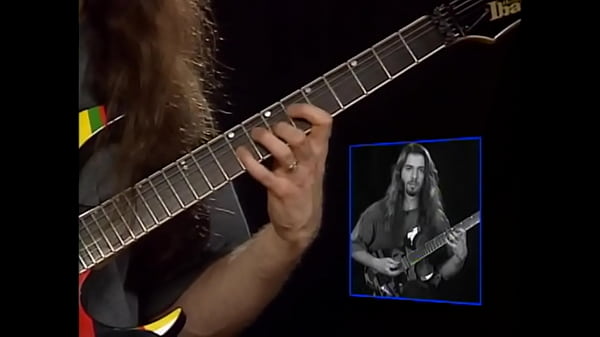 John Petrucci fingering electric guitar  