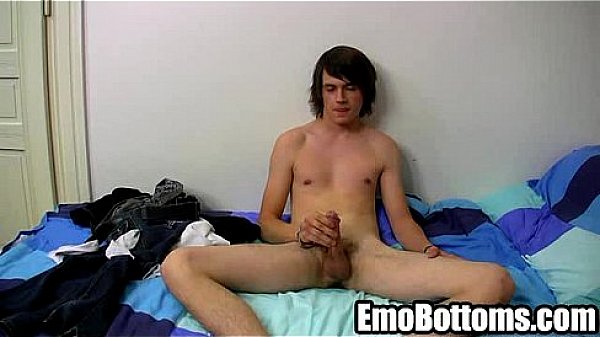 Emo twink Cody Blake tugging on his cock in bed 