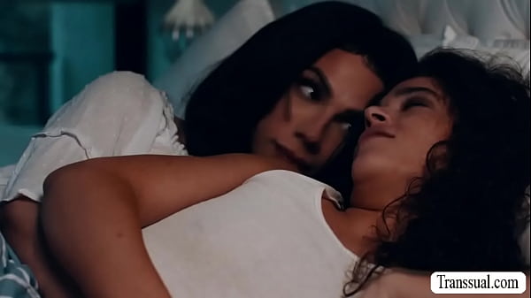 Shemale stepmom and her sexy stepdaughter are kissing on the bed.After that,TS stepmom licks and fucks the tight pussy of stepdaughter. 