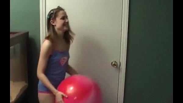 18yo Kitty playing with a puzzle in a miniskirt