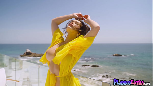 Glamorous huge titted naked cougar posing at her balcony