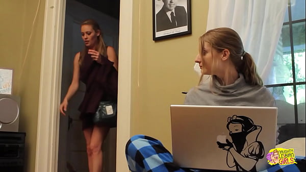 Two slender brunette women clandestinely engage in sexual activity in the kitchen while at work