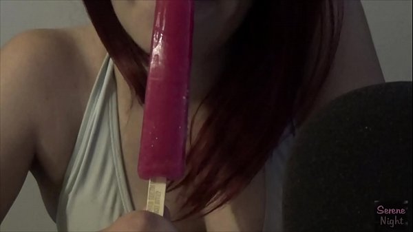 Latina sucking on a frozen pop  