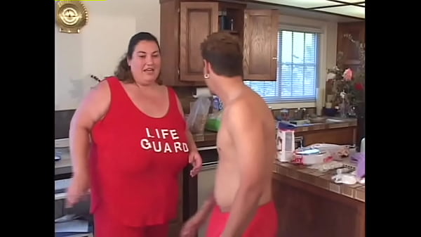 Sexy BBW fucks on a pile of food in the kitchen