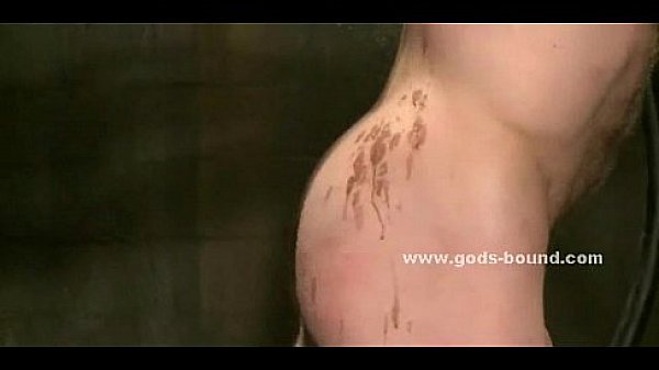 Gay man is bound in leather and fucked