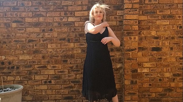 MILF strips and then struggles to pee standing by a wall in the wind