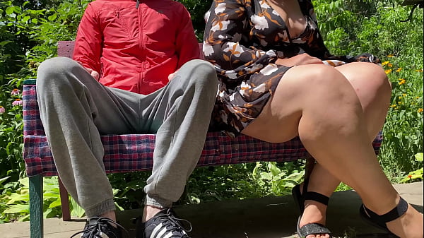 MILF with gorgeous natural breasts pissing on me in a public park