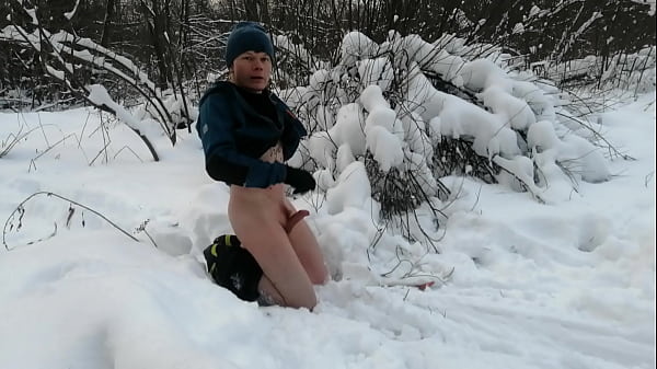 The guy masturbates in the winter on skis with a dildo and cums