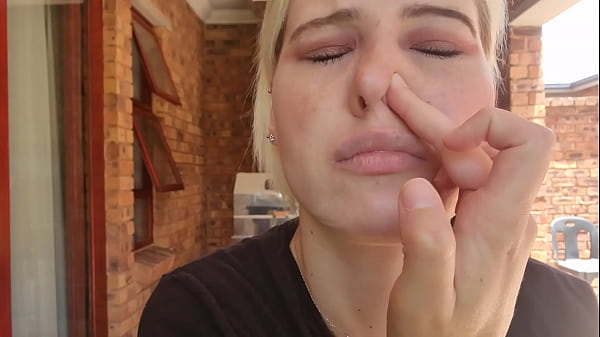 Close up of me blowing my nose as well as picking it and playing with my snot 