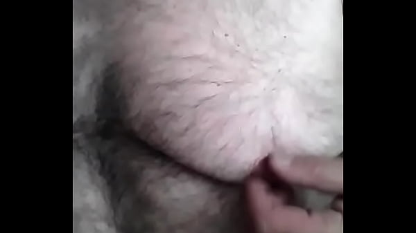 Watching TV playing with my nipples  