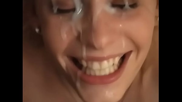 Painting her Face with Cum