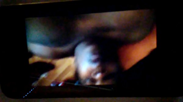 On the floor on her air mattress