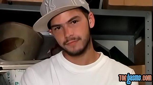 Young man cumshot on feet after wanking 