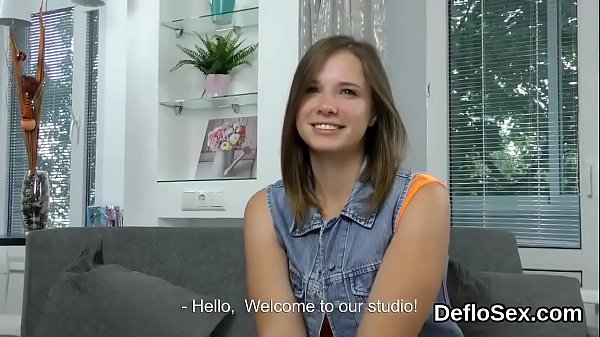 Cute semi-nude beauty fondles her stretched hymen in close-up  