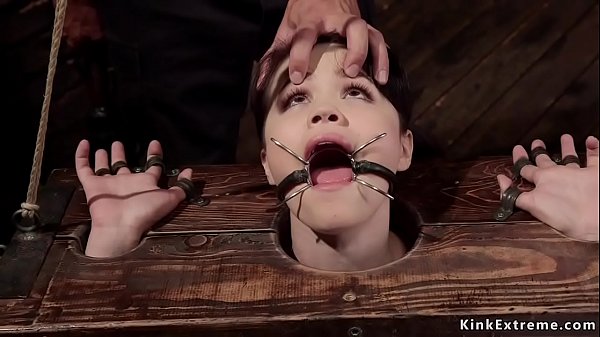 With spider gag in mouth ven haired spinner Yhivi with head and wrists in wooden stock gets hard whipped then master Nomar bangs her hairy cunt