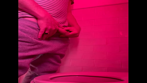 Amateur guy pissing in the toilets of a bar