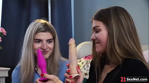 Brunette lesbians shows her blonde friend her sex toys.She gets her naked then licks and fingers her ass and pussy.Her bff anals her with the dildo.  