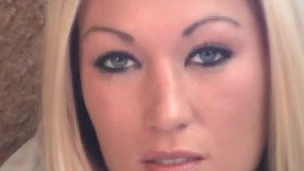 Sexy blonde puts glass dildo inside her