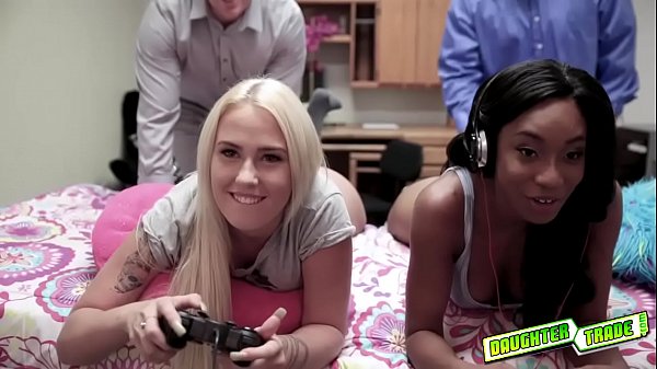 Gamer teens take their joysticks from behind all while keeping their eyes on the screen