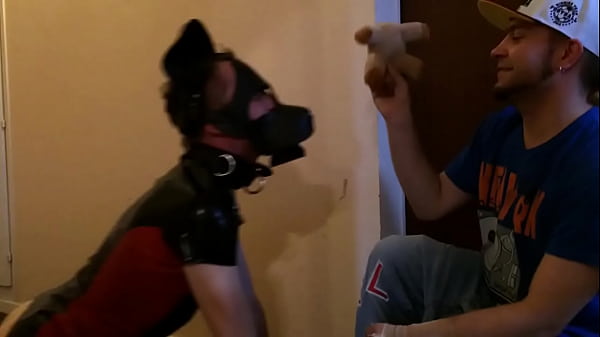 A friend plays with me as a puppy in the hallway in front of my apartment 