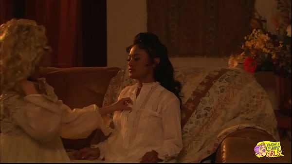 They get sentimental and start kissing on the couch and caress each others small tits