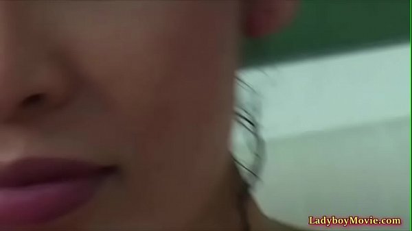 Thai shemale Linda under the shower stream 