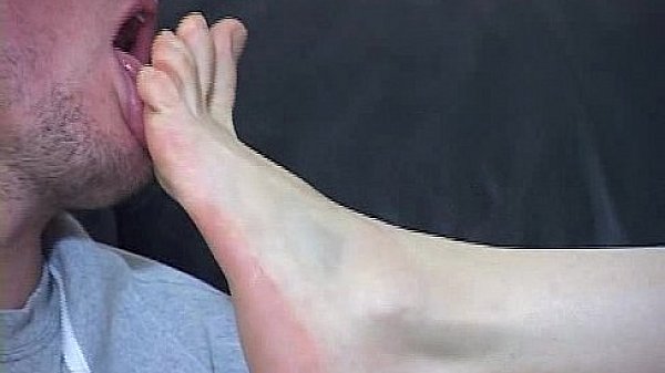 Licking the mistress' feet like a sweet tasty lollipop