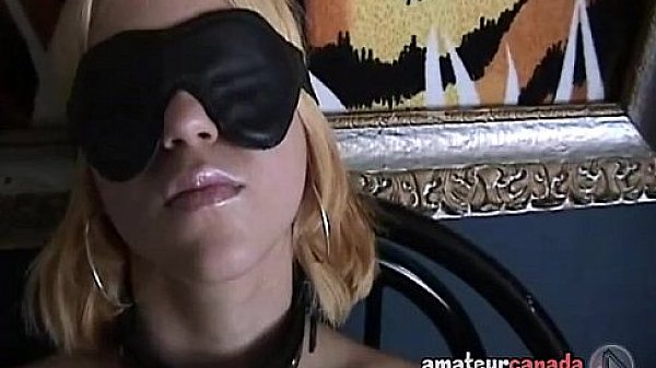 Blindfolded teen submits to sex toys in cuffs