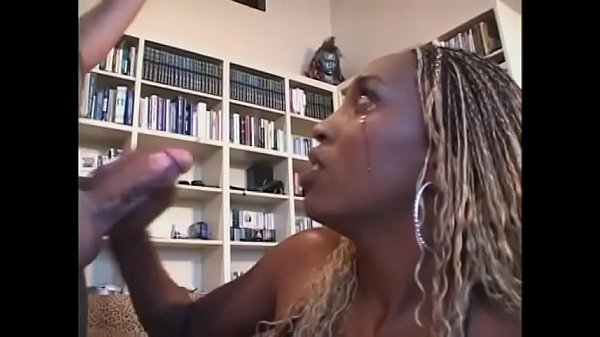 Ebony bitch with white hair fills her twat with fat black dick