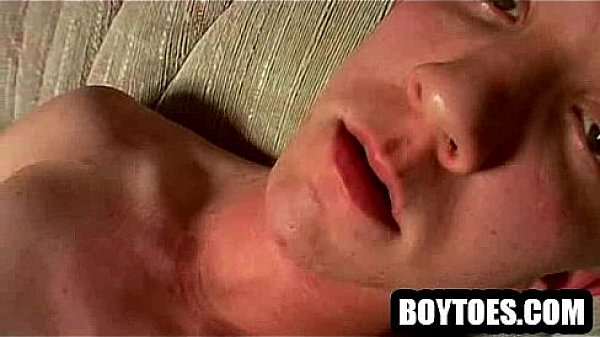 Amateur stud tugs on his cock and shows his feet 