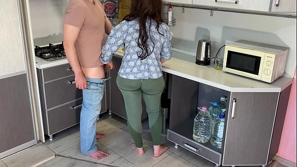 In the kitchen, the stepson took off his stepmom's pants and fucked her in the ass