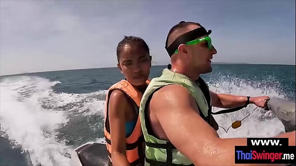 Pretty asian wife gives a blowjob on a jetski