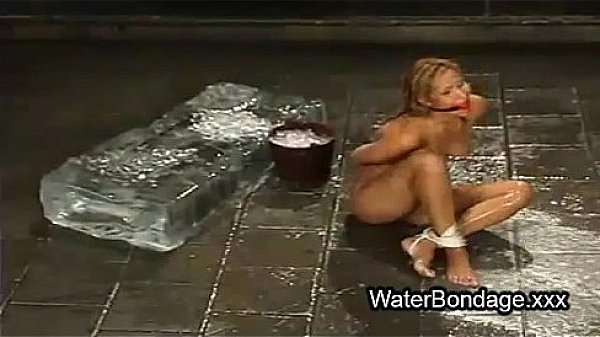 Tied blonde hottie t. with ice and sunk in water tank