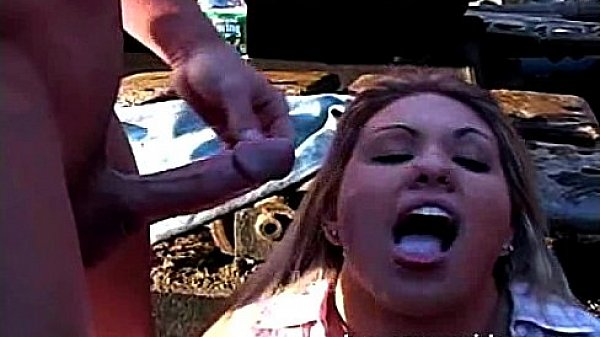 Horny honey shares two cocks outdoors