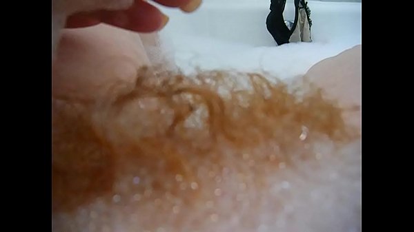 Sexy redhead pornstar Annie Body takes a hot bubble bath and satisfies her urges for a nice release during it! 