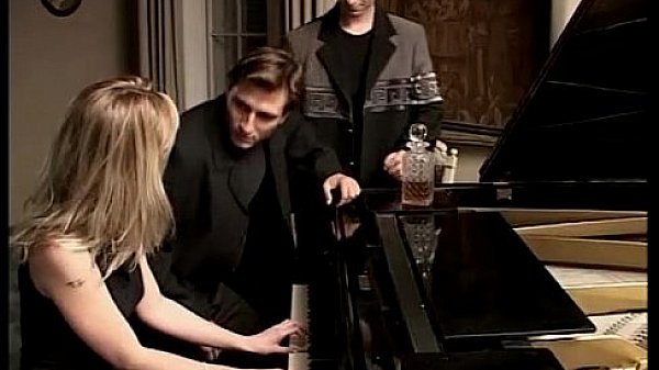 Blonde whore playing piano and two cocks