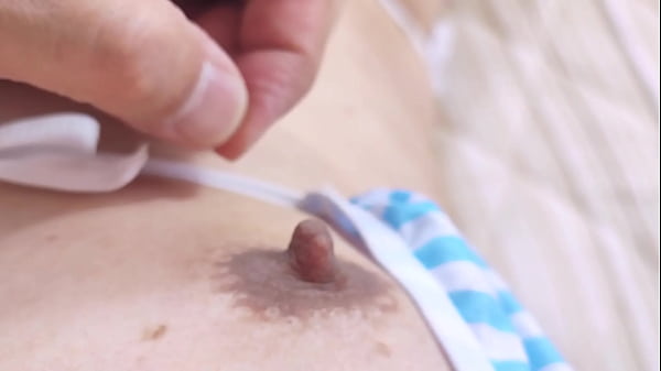 Kotchan wears revealing striped string bikini and masturbates to orgasm while caressing her nipples.