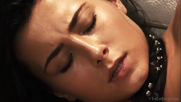 Anna Rose lays nude on a hardwood floor  