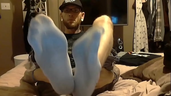 tattooed man smelly socks  