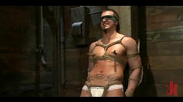 Sexy strong gay hunk gets tied tight