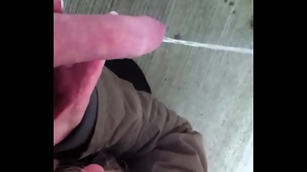 Holding my pissing cock