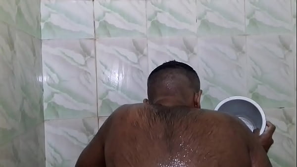 indian guy taking shower  