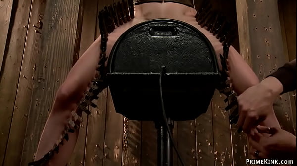 Bound brunette slave Elise Graves in back arch position in the air gets tormented then put on Sybian zippered and gagged till double penetration toyed