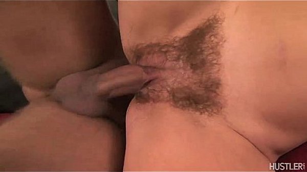 Kathy Anderson parts her hairy lips with a dildo