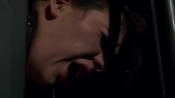 She is in rope chest harness, and her hands are lifted up at her behind. And she suffers, while her Master whipping her.