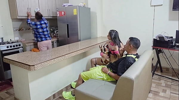 Perverted MILF stepmother fucks her stepson while her husband is in the kitchen