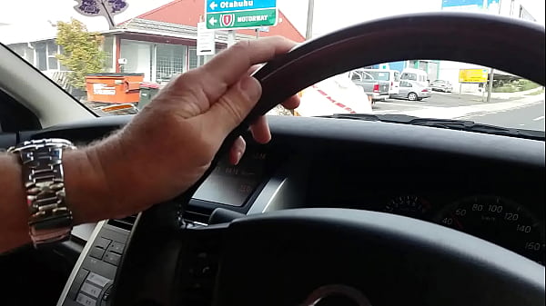 Dirty bitch sucks cock in the car while driving down the road