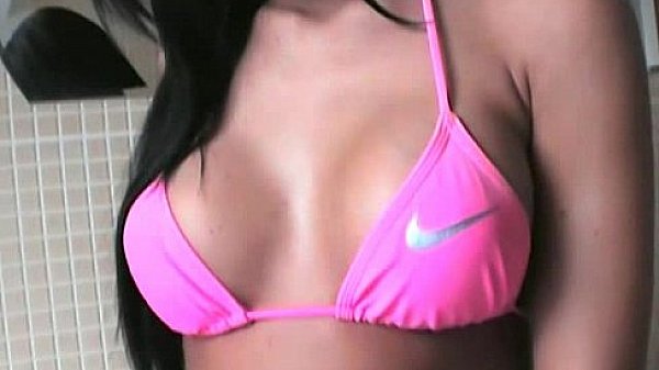 Tanned chick fondling herself in the kitchen