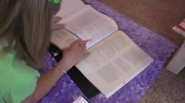 Nerdy science geek Kitty doing her homework