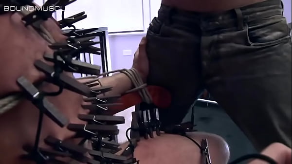 Muscular stud tormented with clothespins and icy hot on his balls  